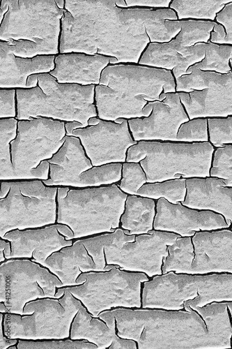 White paint peeling off of a wall
