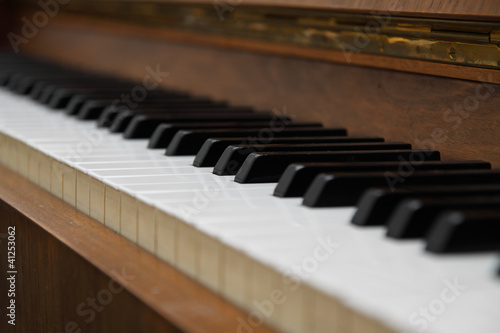 Closeup of antique piano keys.