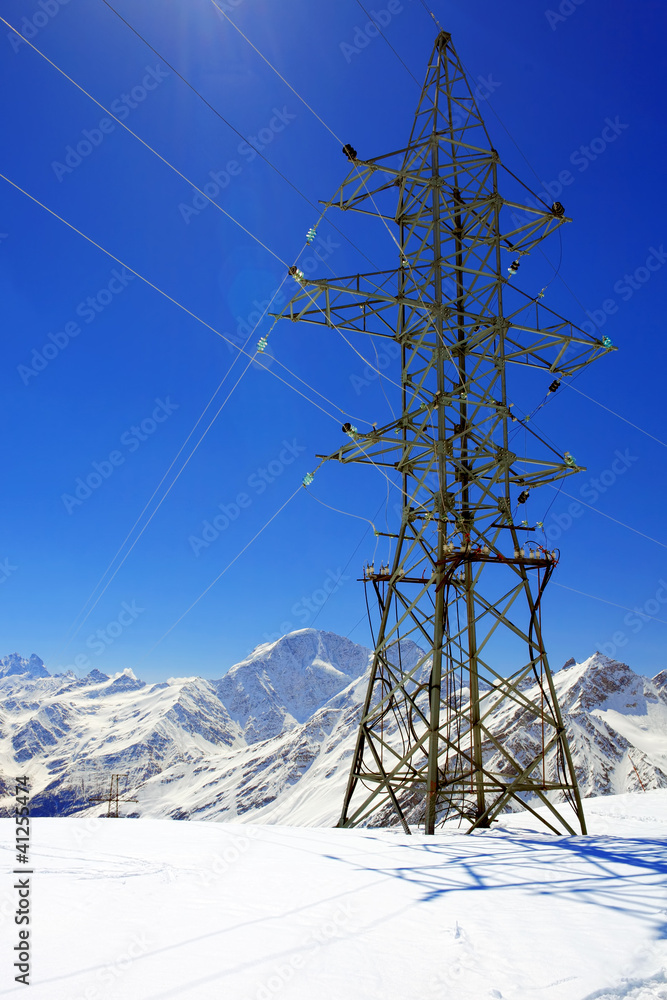 Power line high in the mountains. Power line high in the mountains.