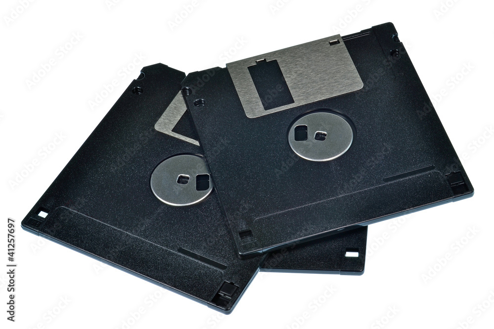 A pile of 3.5 floppy discs isolated on a white background