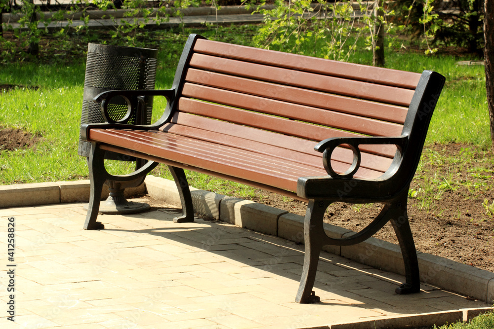 Wooden benches against the background of green grass Wooden benches against the background of green grass