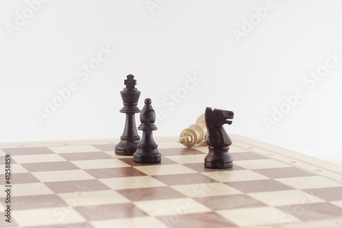 game of chess with wood pieces