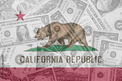US state of california flag with transparent dollar banknotes in
