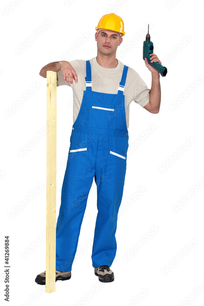 A male carpenter with a drill.