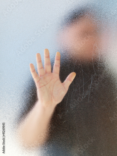 Silhouette of a man's body through frosted glassSilhouette © motorolka