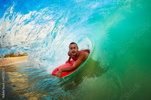 Boogie Boarder in the Barrel Riding Blue Ocean Wave in the Tube