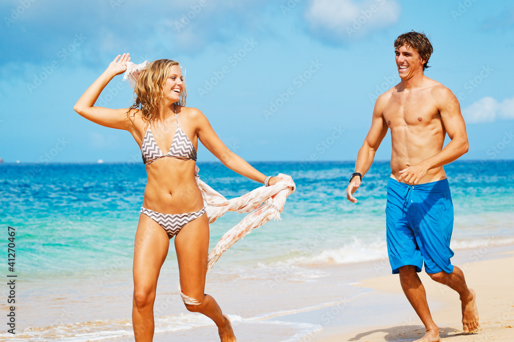 Attractive Couple Having fun on the Beach Attractive Couple Having fun on the Beach