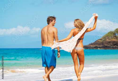 Attractive Couple Having fun on the Beach