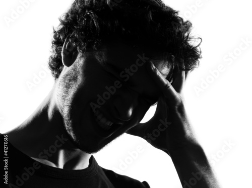 young man silhouette headache sadness