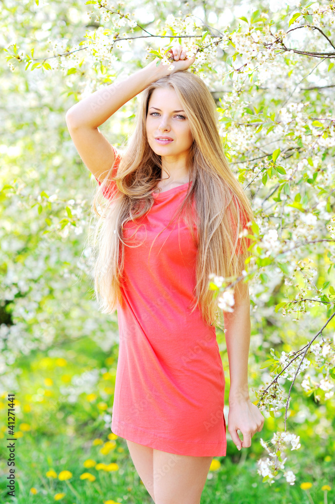 Portrait of beautiful woman in blooming tree in spring Portrait of beautiful woman in blooming tree in spring