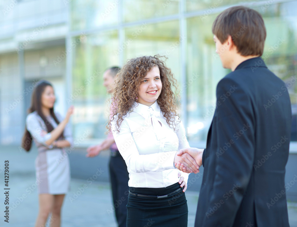 Business partners handshaking after negotiating Business partners handshaking after negotiating