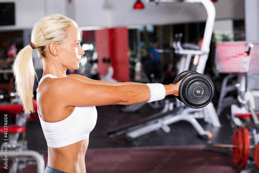 Fototapeta premium fit woman doing workout with dumbbell
