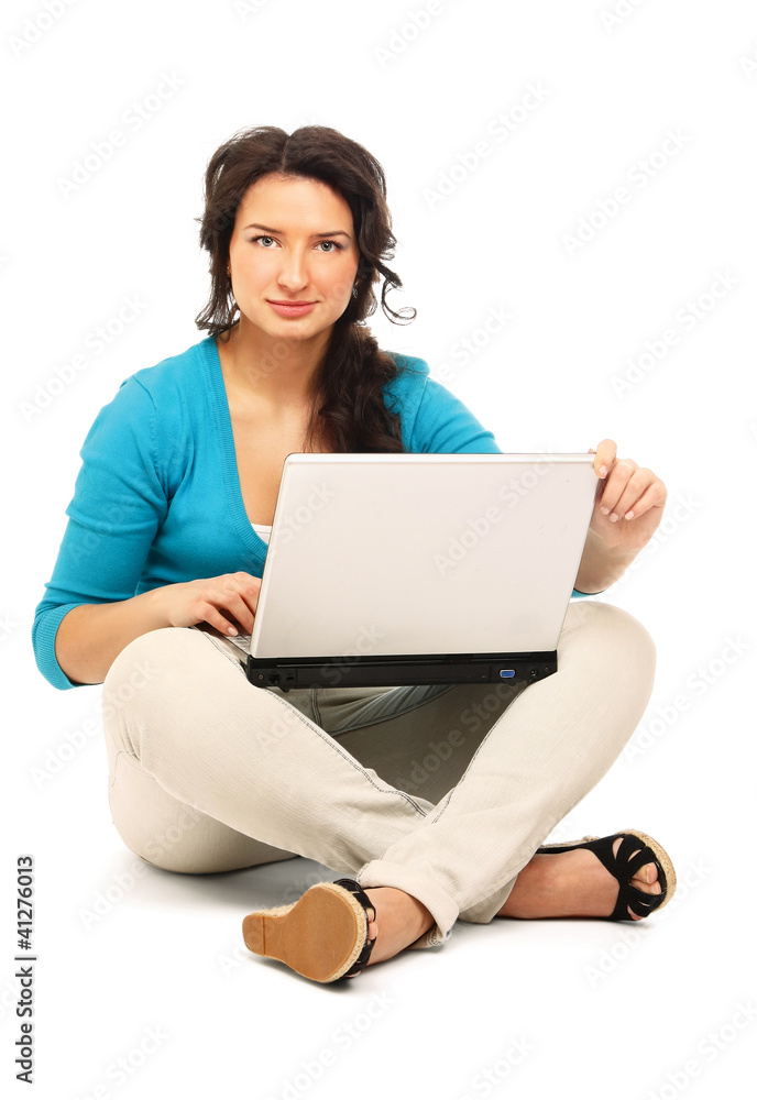 Young girl sitting on the floor with laptop Young girl sitting on the floor with laptop