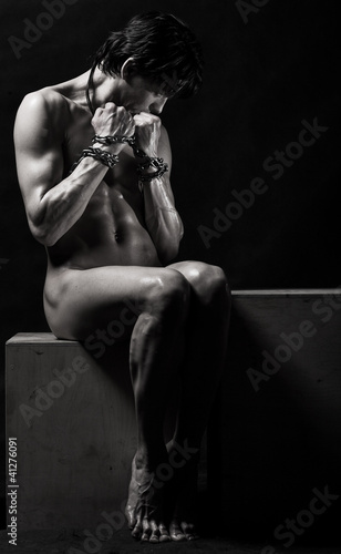 naked athlete with chain