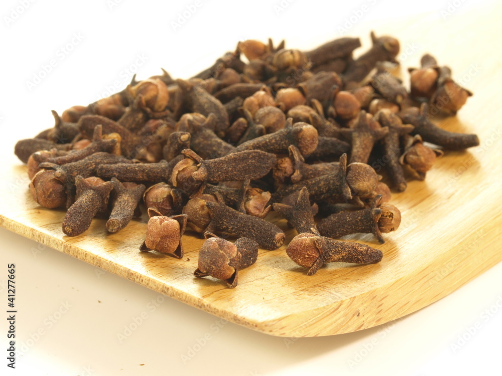 Cloves on tray, closeup, isolated Cloves on tray, closeup, isolated