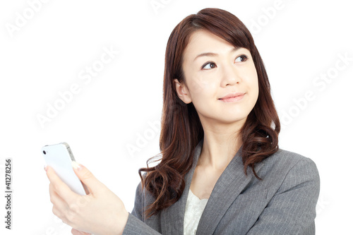 Beautiful business woman using a mobile phone. Portrait of asian