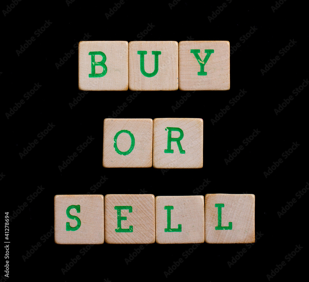 Green letters on old wooden blocks (buy or sell) Green letters on old wooden blocks (buy or sell)