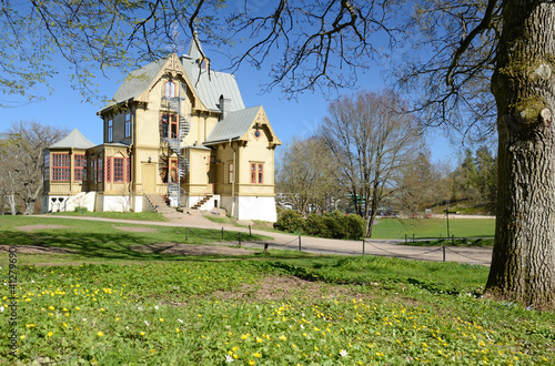 Swedish park's historic house in spring season photo
