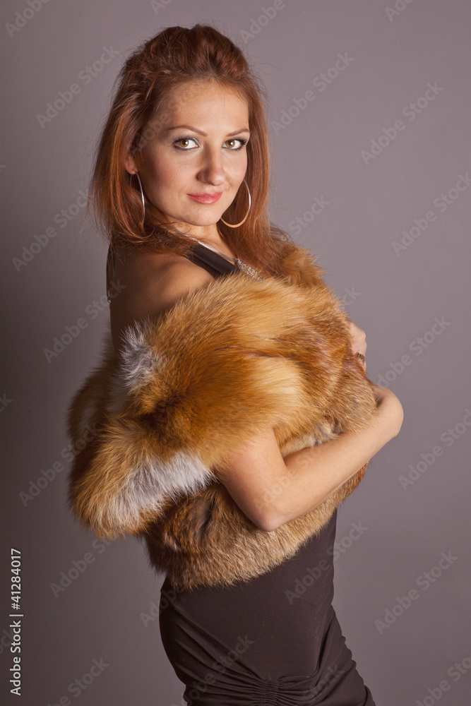 young woman in black dress posing in studio young woman in black dress posing in studio