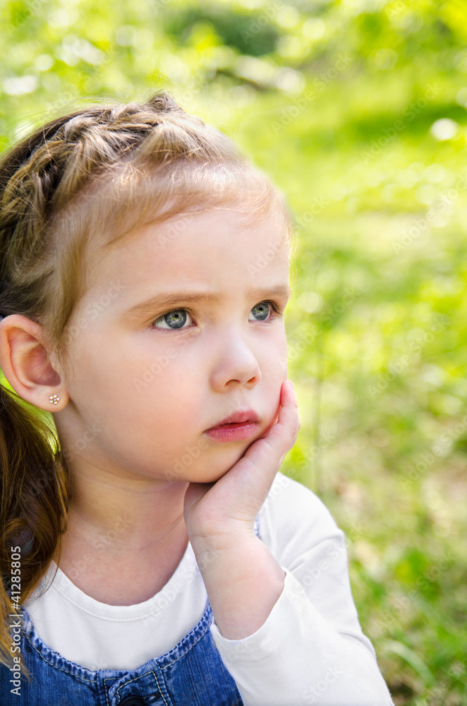 Portrait of thinking little girl outdoor Portrait of thinking little girl outdoor