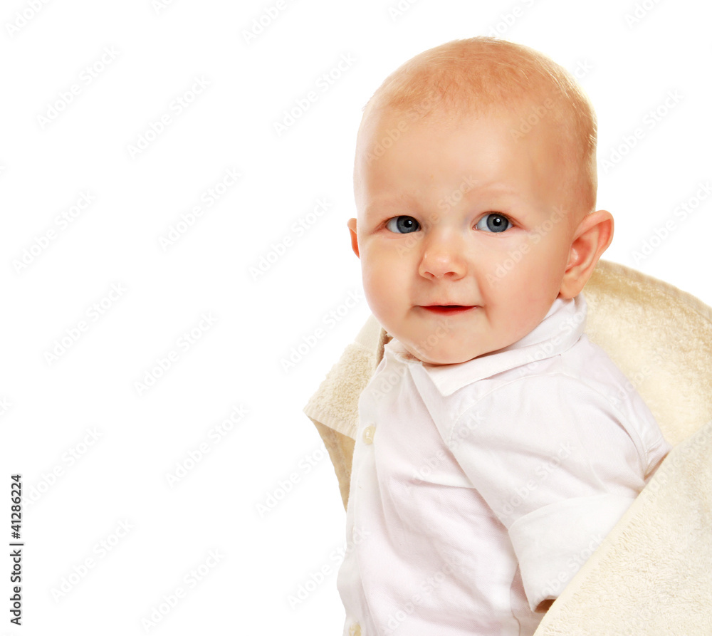 A baby covered with a towel, isolated on white