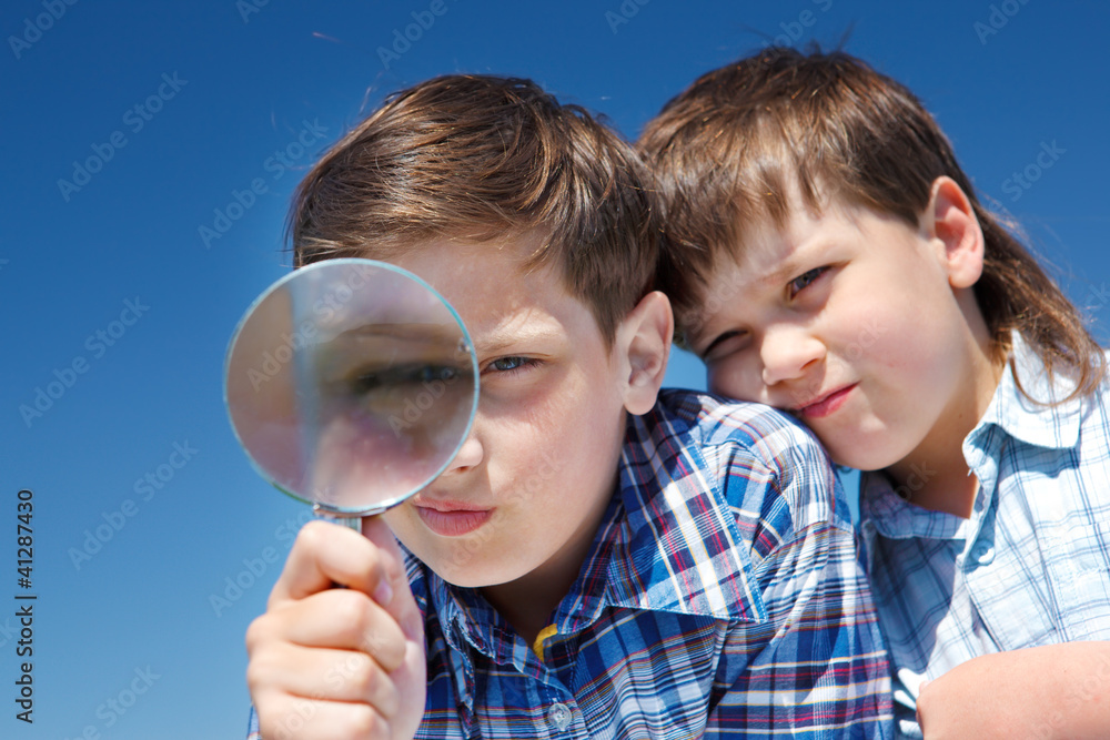 Looking through magnifying glass Looking through magnifying glass