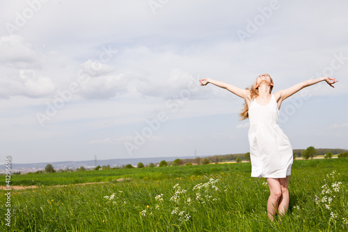 beautiful blonde woman outdoor in summer happy