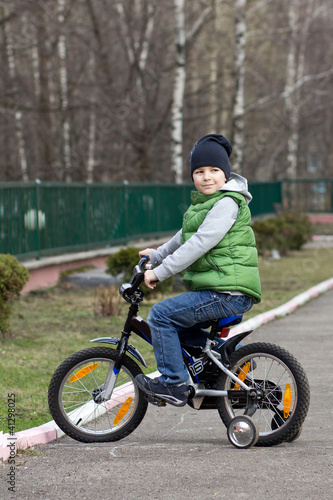 Boy goes for a drive on a bicycle