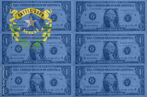 US state of nevada flag with transparent dollar banknotes in bac