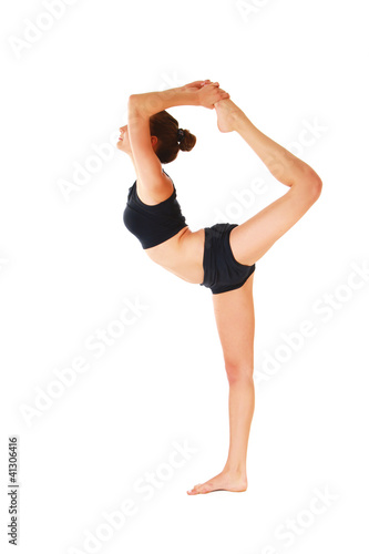 Young woman in black practicing yoga