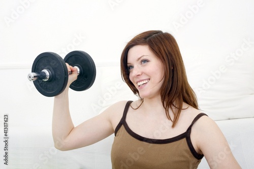 happy woman with dumbbell