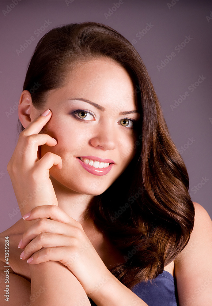 Beautiful woman with makeup on dark background Beautiful woman with makeup on dark background