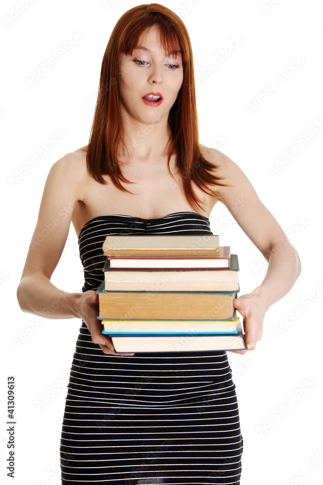 Shocked student girl holding books Shocked student girl holding books