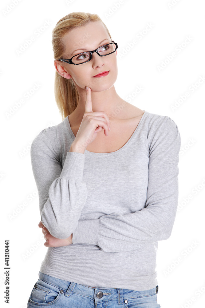 Pretty, happy, young woman in casual clothes thinking Pretty, happy, young woman in casual clothes thinking