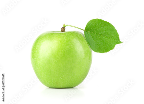 Ripe green apple with a leaf