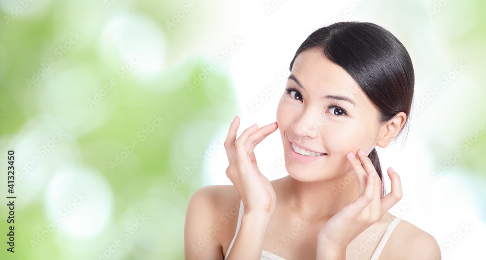 Young woman smile and hand touch face Young woman smile and hand touch face
