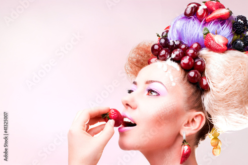 portrait of a woman with a strawberry
