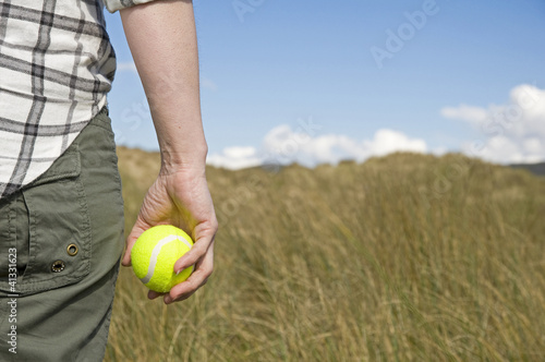 woman holding tennis ball