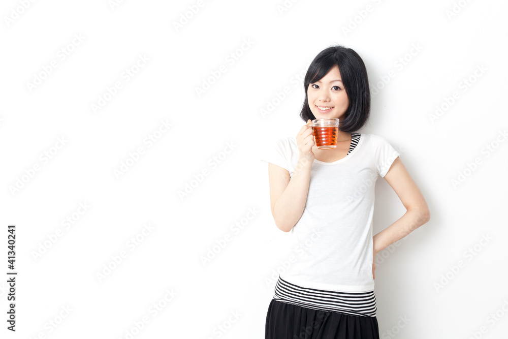 attractive asian woman drinking a cup of tea attractive asian woman drinking a cup of tea