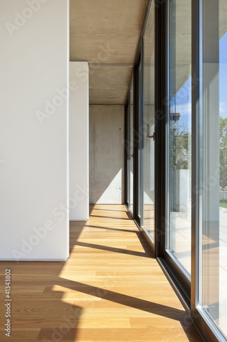 modern concrete house with hardwood floor  large window