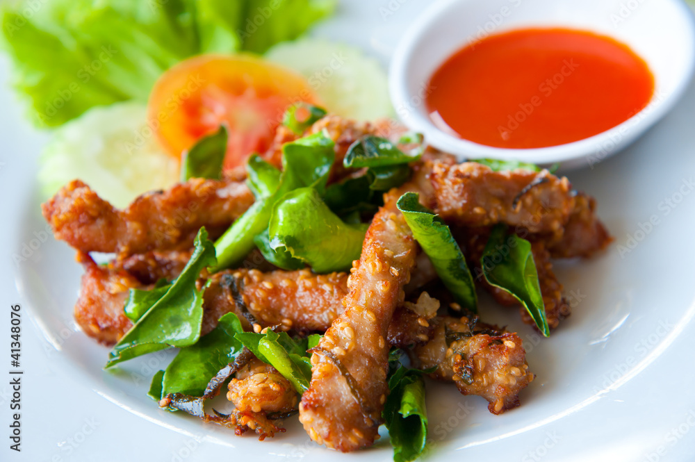 Deep fried pork with leech lime leaf and chili sauce Deep fried pork with leech lime leaf and chili sauce