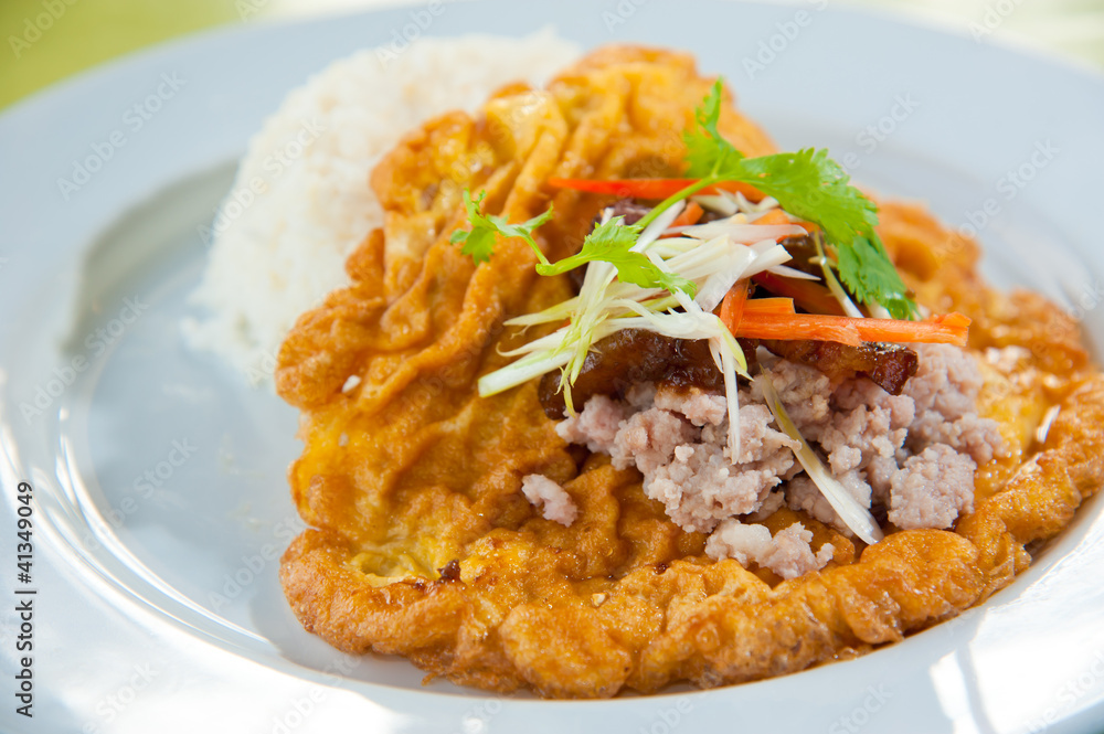 Hot rice with omelet, pork, green herbs and chili sauce Hot rice with omelet, pork, green herbs and chili sauce