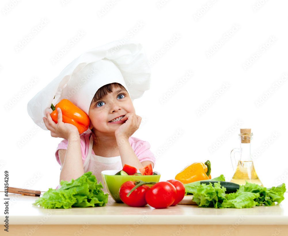 Chef girl preparing healthy food vegetable salad over white back Chef girl preparing healthy food vegetable salad over white back
