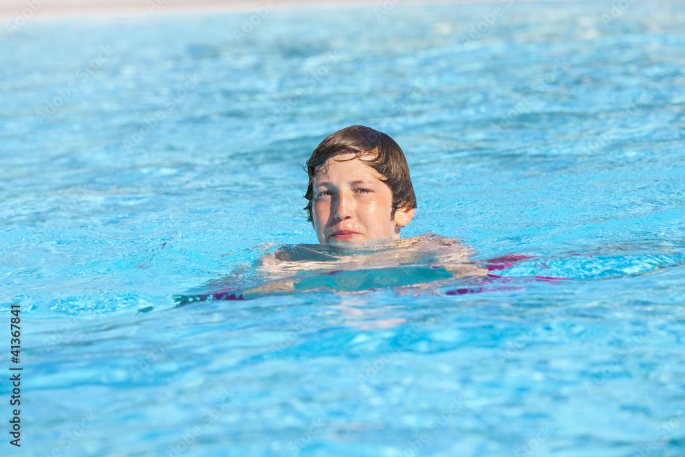 boy swimming in the pool