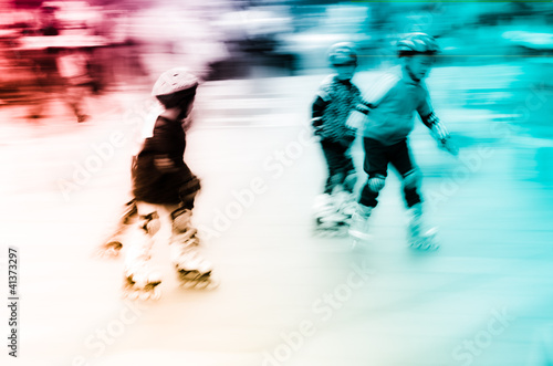Fototapeta child playing rollerblade