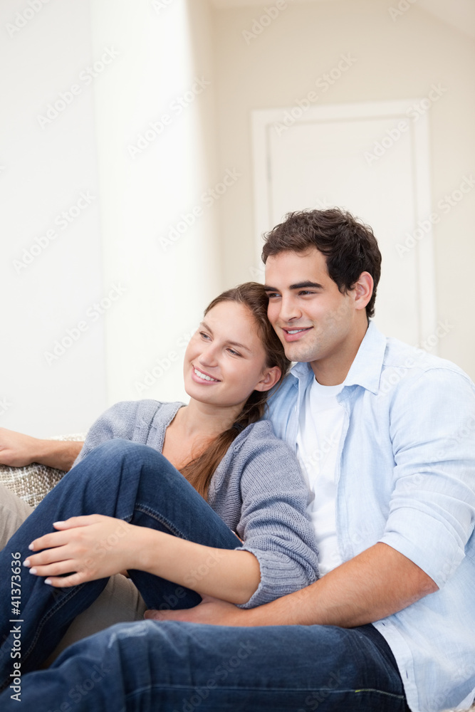 Couple sitting while embracing each other Couple sitting while embracing each other