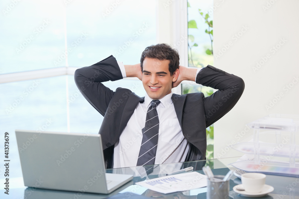 Man crossing his arms behind his head Man crossing his arms behind his head