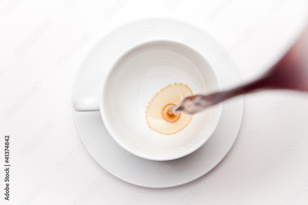Empty coffee cup being filled Empty coffee cup being filled