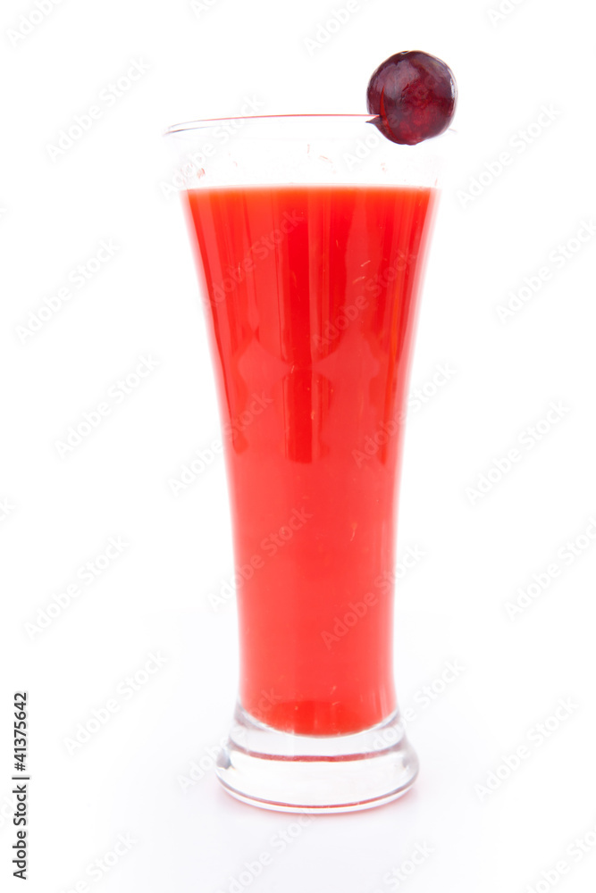 Currant on a glass full of berries juice Currant on a glass full of berries juice