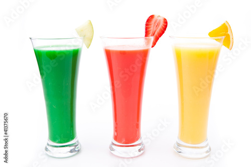 fruit pieces in a row of glasses